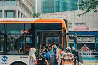 People getting on bus